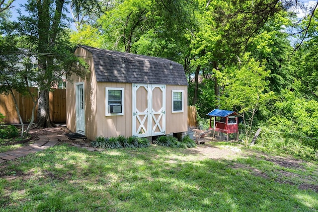 view of shed with fence