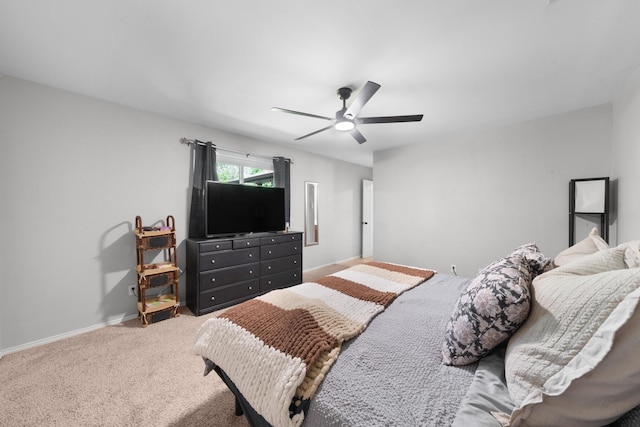 bedroom featuring carpet, baseboards, and ceiling fan