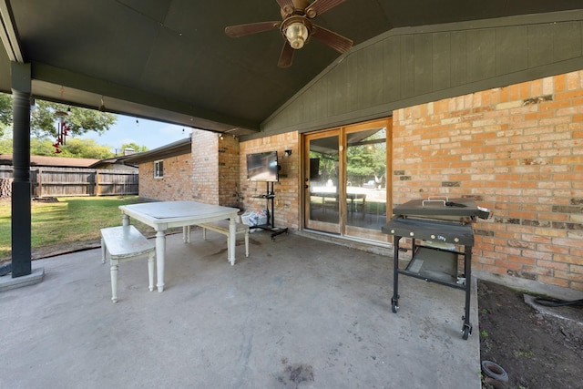 view of patio with fence, ceiling fan, and area for grilling
