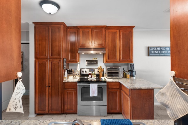 kitchen featuring stainless steel electric range, light tile patterned floors, a toaster, under cabinet range hood, and light stone countertops