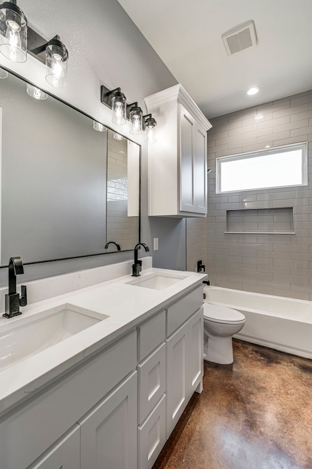 bathroom featuring visible vents, a sink, concrete floors, and toilet