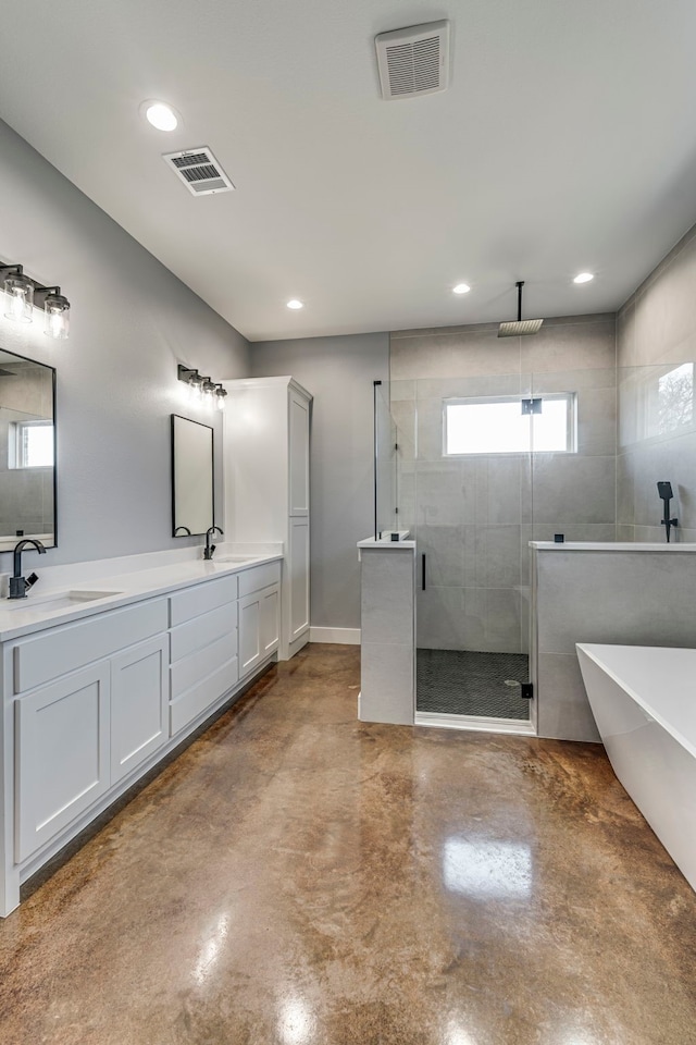 full bathroom with concrete flooring, visible vents, a stall shower, and a sink
