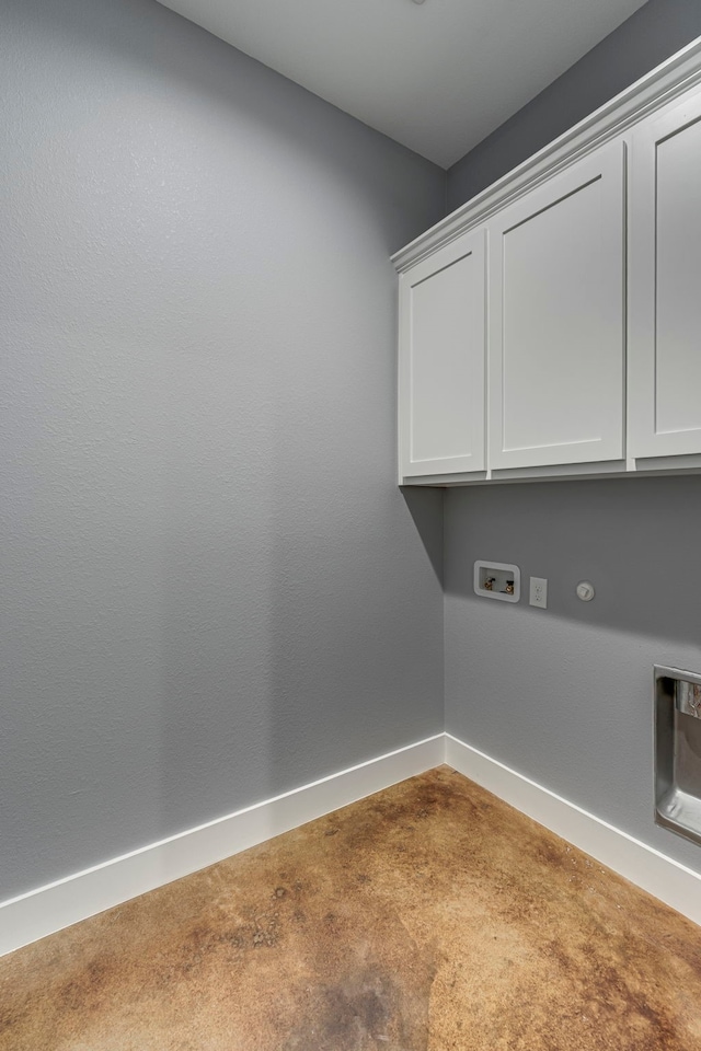 laundry area with baseboards, cabinet space, carpet flooring, and washer hookup