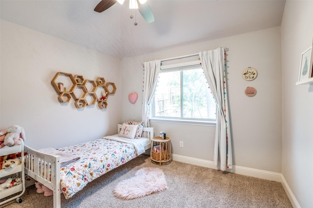 bedroom with carpet floors, a ceiling fan, and baseboards