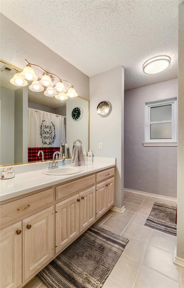 259 Deer Valley Dr, Powderly, TX 75473 - full bath with visible vents, vanity, tile patterned floors, and a textured ceiling