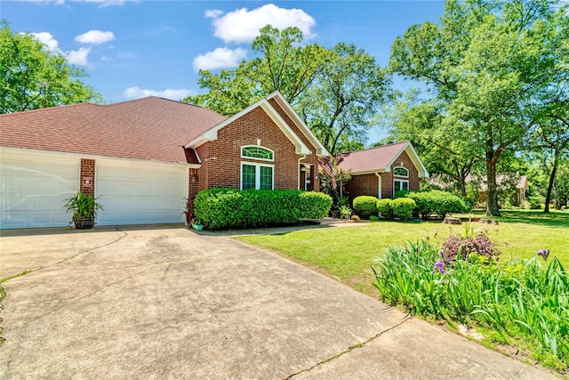 259 Deer Valley Dr, Powderly, TX 75473 - single story home with an attached garage, brick siding, driveway, and a front yard
