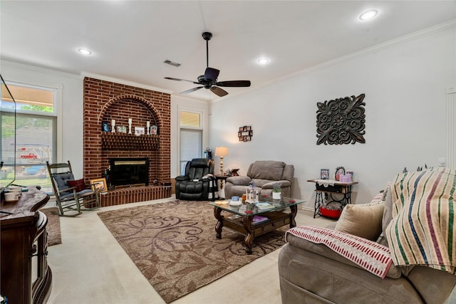259 Deer Valley Dr, Powderly, TX 75473 - living area featuring visible vents, a brick fireplace, ceiling fan, carpet floors, and ornamental molding