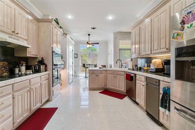 259 Deer Valley Dr, Powderly, TX 75473 - kitchen with stainless steel appliances, a sink, a ceiling fan, under cabinet range hood, and tile countertops
