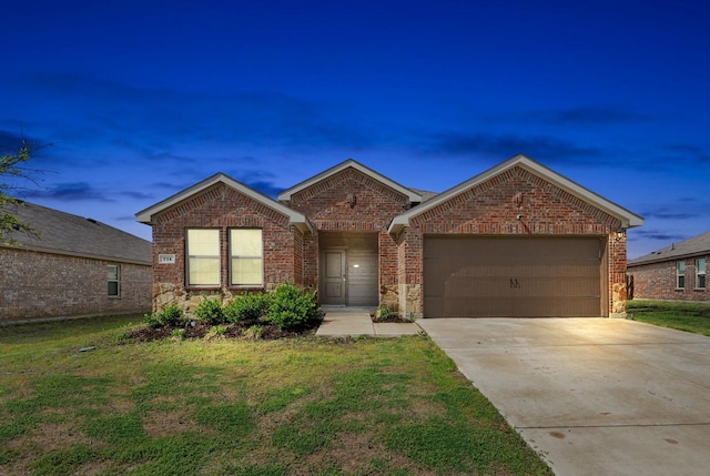 ranch-style home featuring concrete driveway, an attached garage, brick siding, and a front lawn