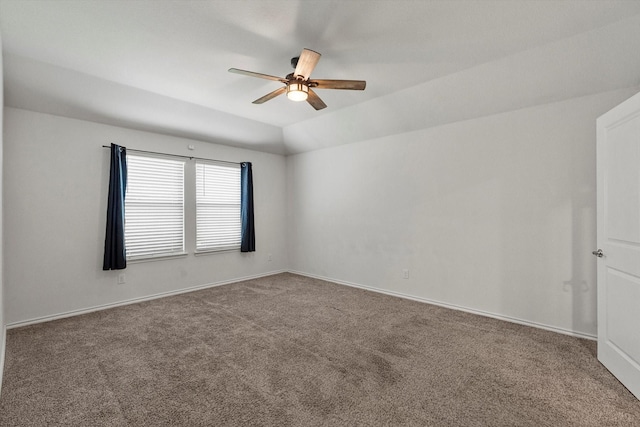 unfurnished room featuring lofted ceiling, carpet floors, a ceiling fan, and baseboards
