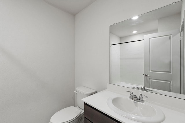 full bath with vanity, recessed lighting, and toilet