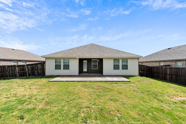 back of property featuring a fenced backyard, a patio area, and a lawn