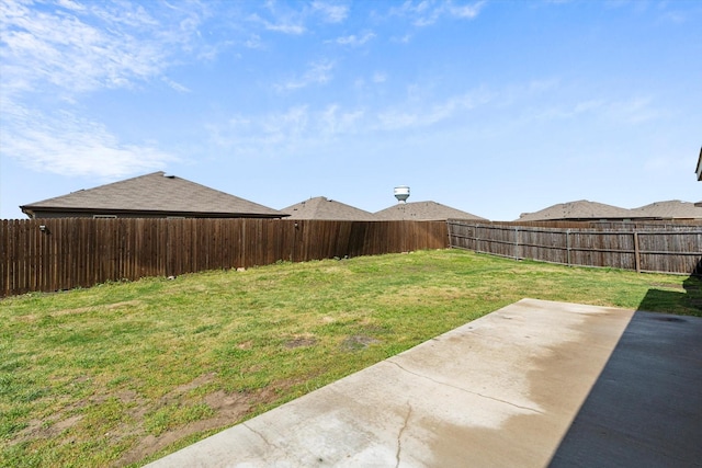 view of yard featuring a patio area and a fenced backyard