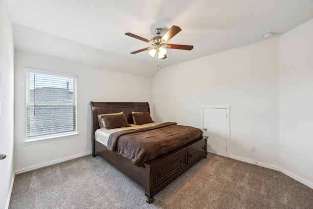bedroom with carpet floors, a ceiling fan, lofted ceiling, and baseboards