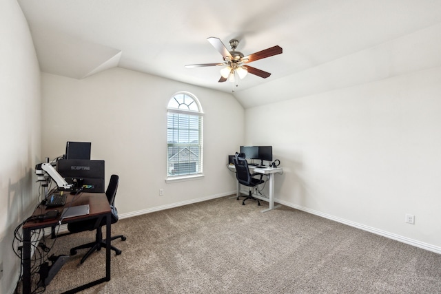 office area featuring lofted ceiling, baseboards, a ceiling fan, and carpet flooring