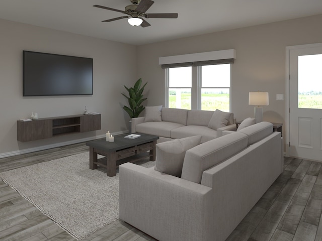living area featuring plenty of natural light, a ceiling fan, and wood finished floors