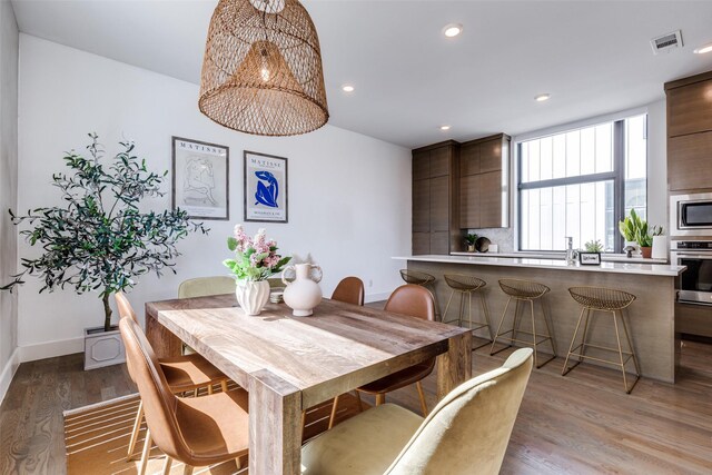1922 La Croix Pl, Dallas, TX 75214 - dining room featuring baseboards, wood finished floors, and recessed lighting