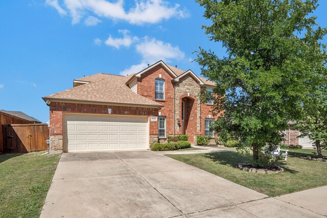 3059 Seabrook Dr, Little Elm, TX 75068 - traditional-style home with a garage, a shingled roof, driveway, and a front yard
