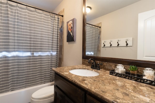full bath with shower / bath combo, toilet, and vanity