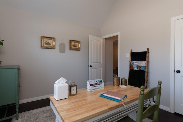 office area with vaulted ceiling and baseboards