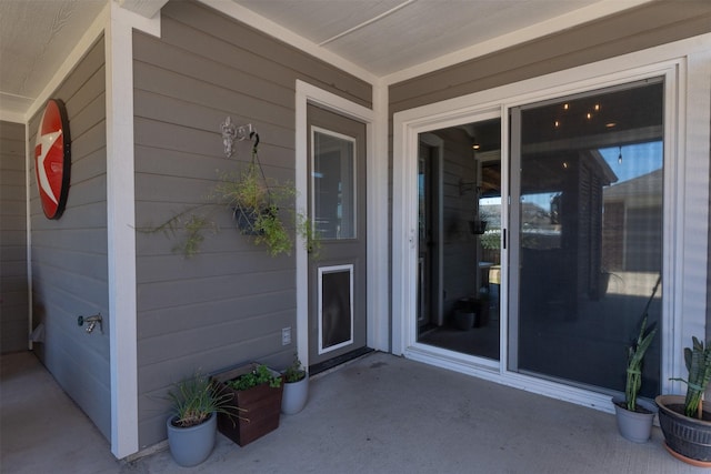 property entrance with a patio