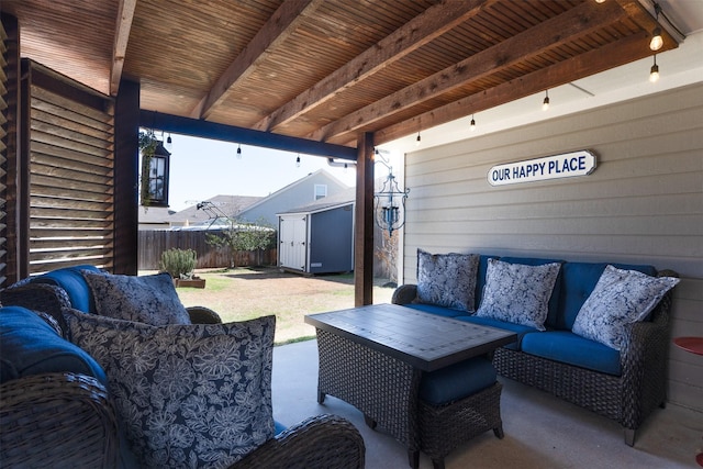 view of patio with a fenced backyard, an outdoor structure, an outdoor living space, and a storage shed