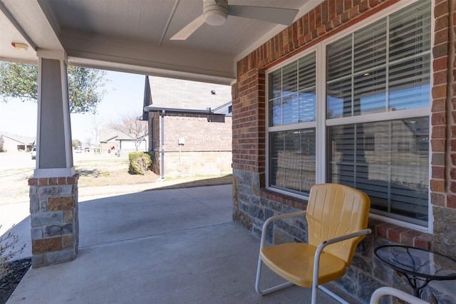 view of patio featuring ceiling fan