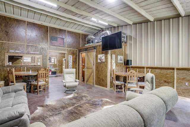 7203 Pump Station Rd, Jacksboro, TX 76458 - living room with concrete floors, a barn door, and a towering ceiling