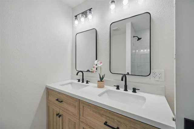 full bath with a sink and double vanity