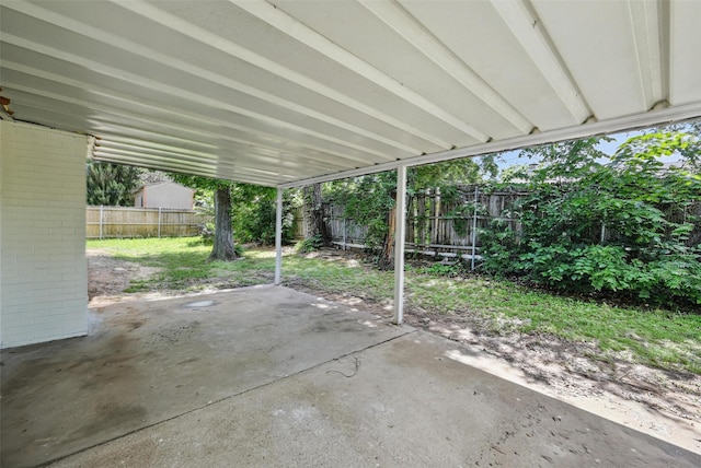 view of patio with a carport and a fenced backyard