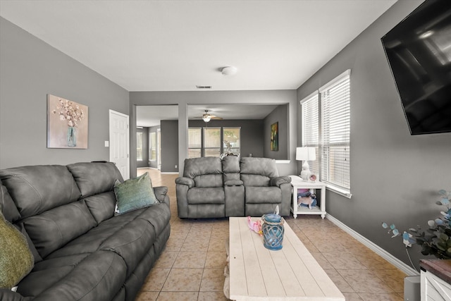 6521 Fitzgerald St, Fort Worth, TX 76179 - living area with light tile patterned floors, baseboards, and ceiling fan