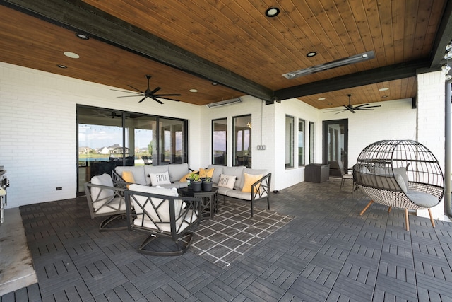 view of patio / terrace with an outdoor living space and ceiling fan