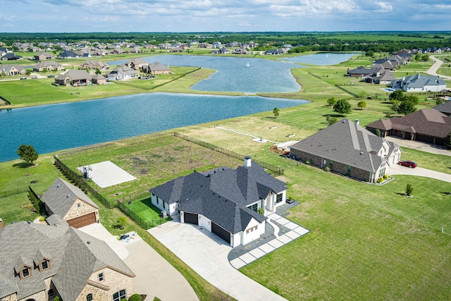 aerial view with a residential view and a water view