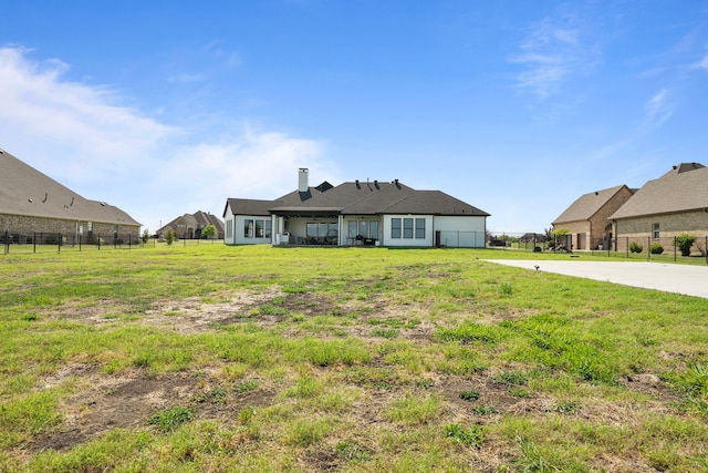 view of front of home featuring a chimney and fence