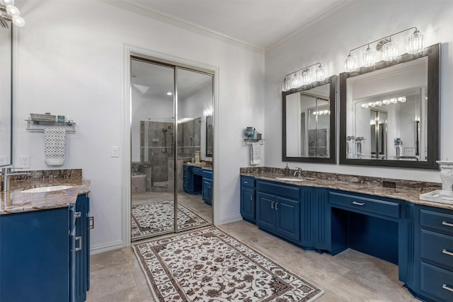 full bathroom featuring a sink, two vanities, ornamental molding, and a shower stall