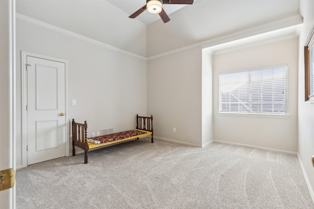 bedroom with carpet floors, crown molding, visible vents, baseboards, and a ceiling fan