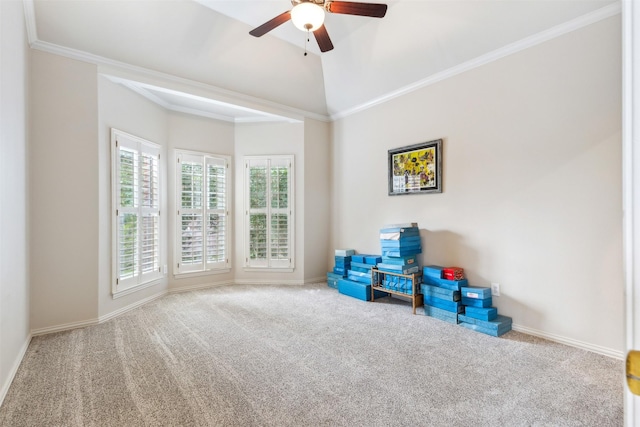 rec room with baseboards, carpet flooring, a ceiling fan, and ornamental molding