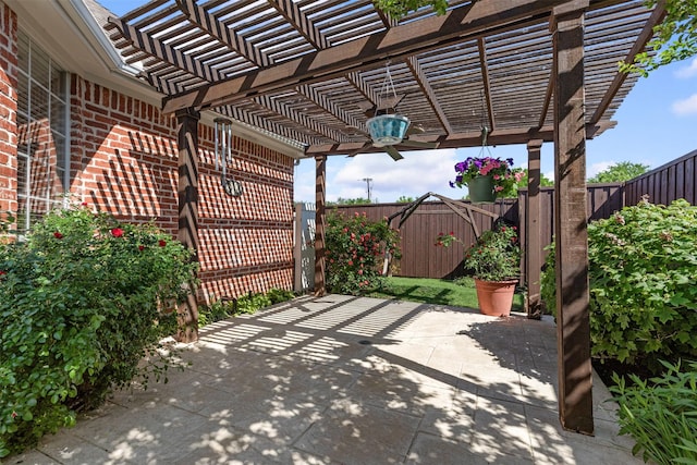 view of patio / terrace with a pergola and a fenced backyard