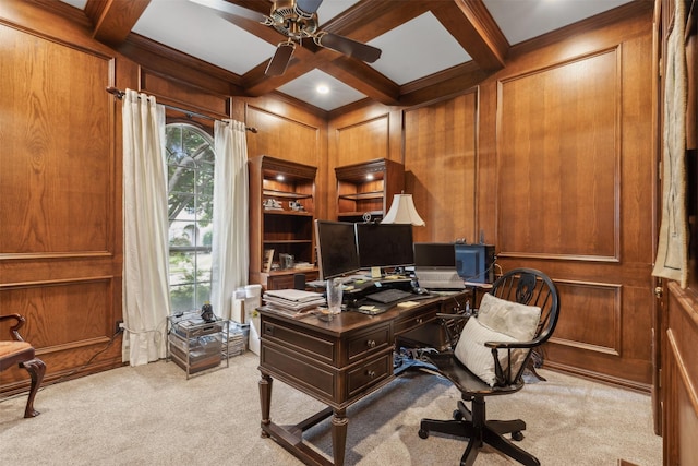 office space with ceiling fan, beam ceiling, wooden walls, light carpet, and coffered ceiling