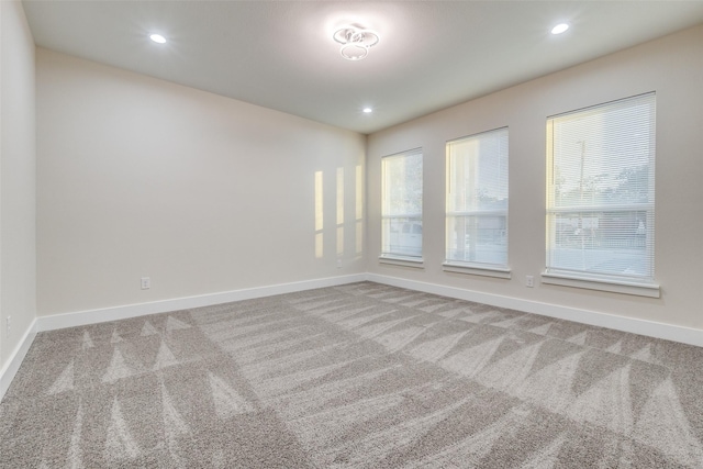 1963 Dennison St, Dallas, TX 75212 - carpeted spare room featuring baseboards and recessed lighting