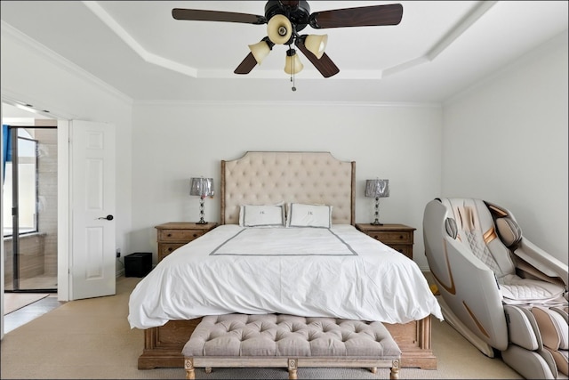 bedroom with a tray ceiling, ornamental molding, a ceiling fan, and light carpet