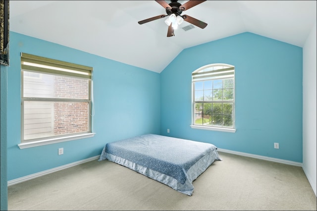 bedroom with ceiling fan, carpet floors, baseboards, lofted ceiling, and visible vents