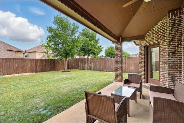 exterior space with an outdoor living space, ceiling fan, and a fenced backyard