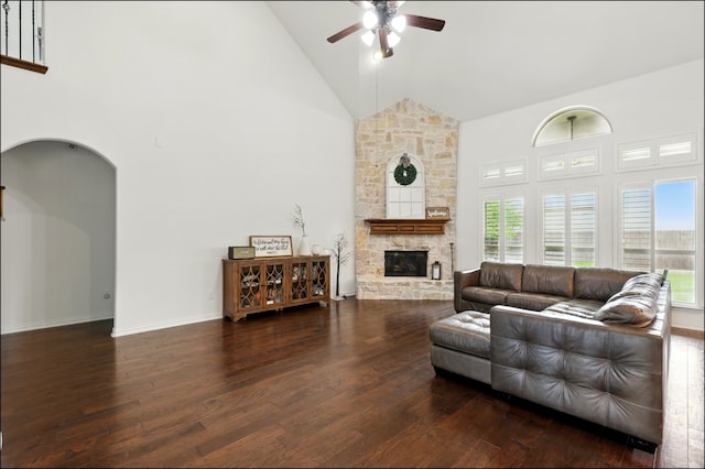 living room featuring wood finished floors, high vaulted ceiling, ceiling fan, and plenty of natural light