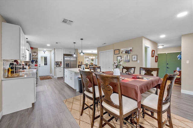 1410 Hummingbird Dr, Hillsboro, TX 76645 - dining area with recessed lighting, visible vents, a chandelier, and light wood-type flooring