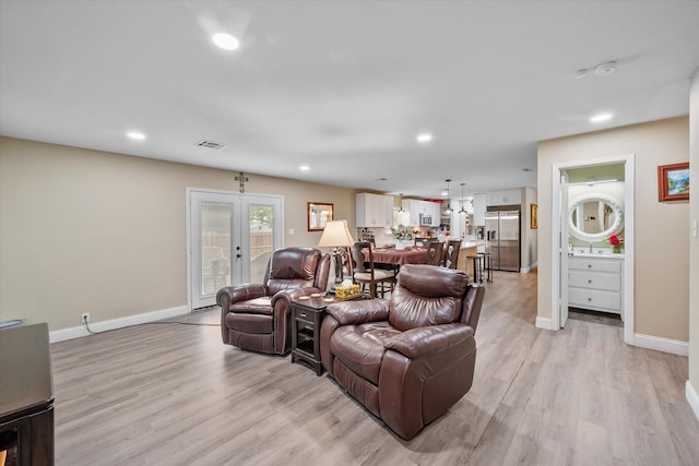 1410 Hummingbird Dr, Hillsboro, TX 76645 - living area with recessed lighting, visible vents, baseboards, and light wood-style floors