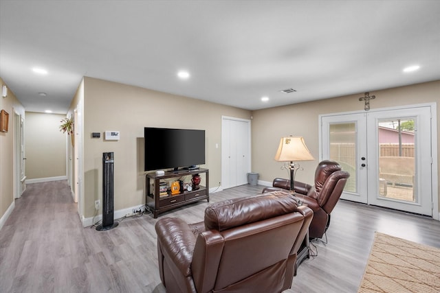 1410 Hummingbird Dr, Hillsboro, TX 76645 - living area with french doors, recessed lighting, and light wood-style flooring