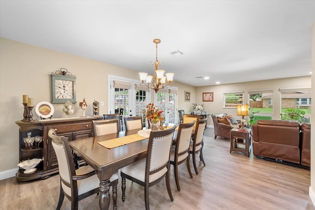 1410 Hummingbird Dr, Hillsboro, TX 76645 - dining space with recessed lighting, light wood-style flooring, baseboards, visible vents, and a notable chandelier
