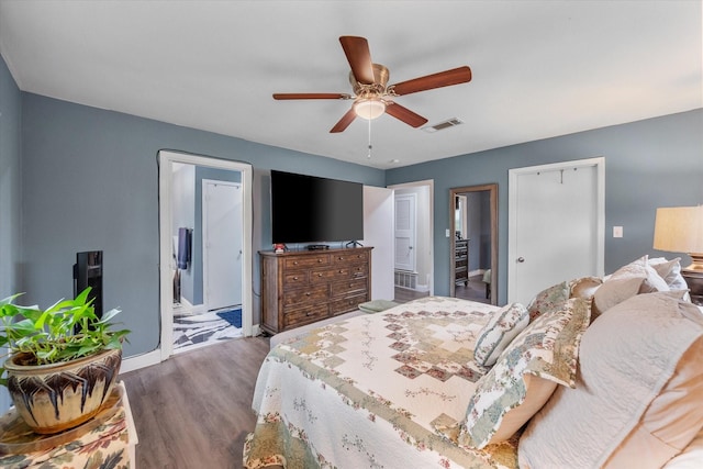 1410 Hummingbird Dr, Hillsboro, TX 76645 - bedroom featuring a ceiling fan, visible vents, baseboards, wood finished floors, and ensuite bathroom