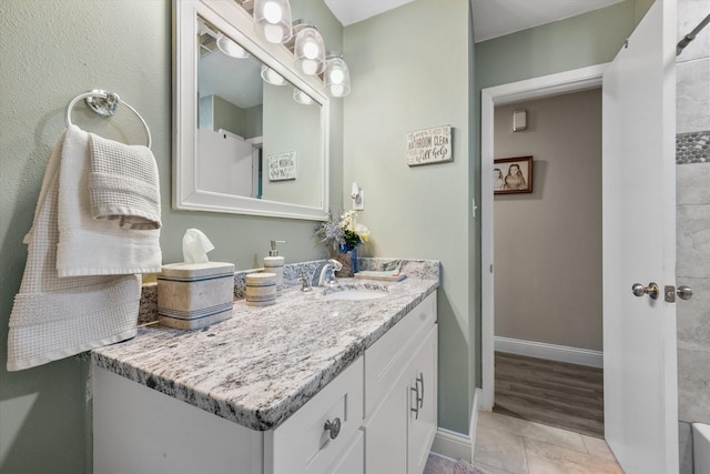 1410 Hummingbird Dr, Hillsboro, TX 76645 - full bathroom with baseboards, visible vents, tile patterned floors, and vanity
